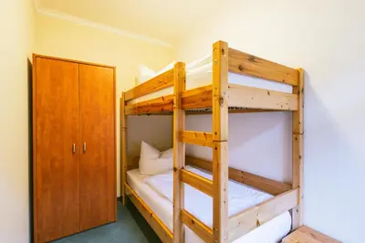 Ein Bett oder Betten in einem Zimmer der Unterkunft Gästehaus am Kurpark