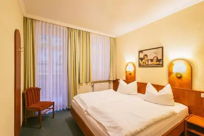 Ein Bett oder Betten in einem Zimmer der Unterkunft Gästehaus am Kurpark