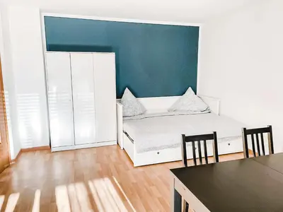 Ein Bett oder Betten in einem Zimmer der Unterkunft Schöne Wohnung, eigene Terrasse, privater Parkplatz, Wi-Fi, Waschmaschine, 3P