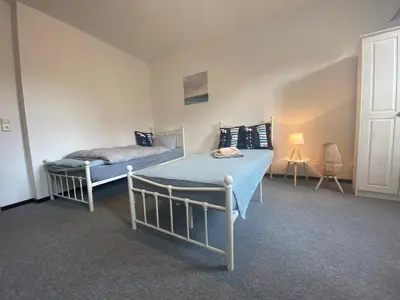 Ein Bett oder Betten in einem Zimmer der Unterkunft Fewo Sachsenhöhe