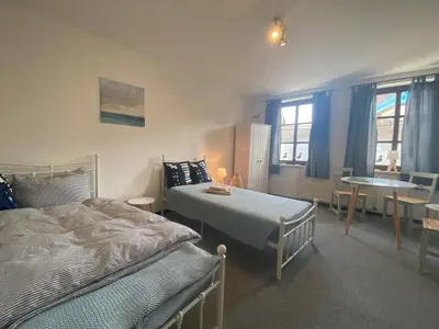 Ein Bett oder Betten in einem Zimmer der Unterkunft Fewo Sachsenhöhe