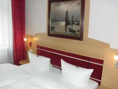 Ein Bett oder Betten in einem Zimmer der Unterkunft Pension Dresdener Panorama