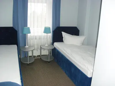 Ein Bett oder Betten in einem Zimmer der Unterkunft Pension Dresdener Panorama