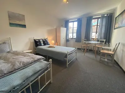 Ein Bett oder Betten in einem Zimmer der Unterkunft Sachsenhöhe