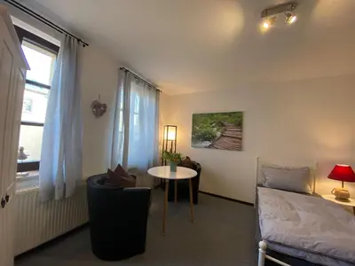 Ein Bett oder Betten in einem Zimmer der Unterkunft Sachsenhöhe