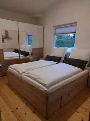 Ein Bett oder Betten in einem Zimmer der Unterkunft elephants Ferienhaus Haus Ost