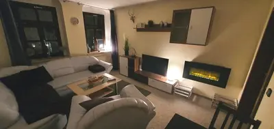 Ein Sitzbereich in der Unterkunft Stadthotel