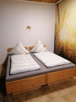 Ein Bett oder Betten in einem Zimmer der Unterkunft Schöne Wohnung im Herzen von Burgstädt