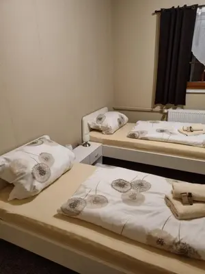 Ein Bett oder Betten in einem Zimmer der Unterkunft Pension Torgau