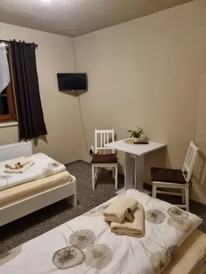 Ein Bett oder Betten in einem Zimmer der Unterkunft Pension Torgau
