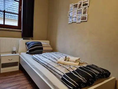 Ein Bett oder Betten in einem Zimmer der Unterkunft Pension Torgau