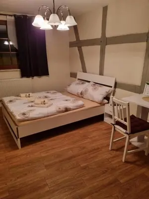 Ein Bett oder Betten in einem Zimmer der Unterkunft Pension Torgau