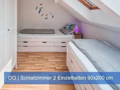Ein Bett oder Betten in einem Zimmer der Unterkunft Ferienhaus Elbharmonie - Hunde willkommen, Garten vollständig umzäunt, Pool, Kamin und Spielzimmer - super für Familientreffen