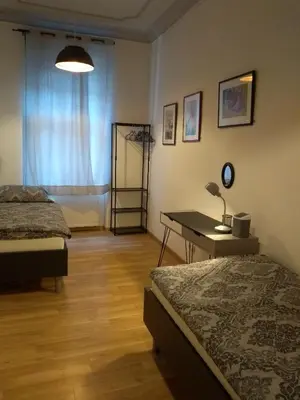 Ein Bett oder Betten in einem Zimmer der Unterkunft Ferienwohnungen in der Kunstgalerie