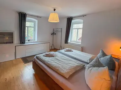 Ein Bett oder Betten in einem Zimmer der Unterkunft Villa Falkenstein