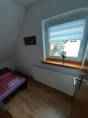 Ein Bett oder Betten in einem Zimmer der Unterkunft FeWo Zur Alten Drechslerei