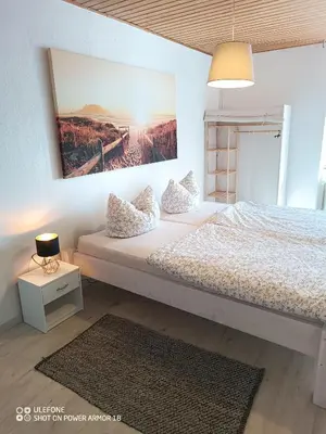 Ein Bett oder Betten in einem Zimmer der Unterkunft Ferienwohnung Großdobritz