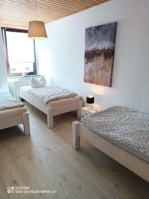 Ein Bett oder Betten in einem Zimmer der Unterkunft Ferienwohnung Großdobritz