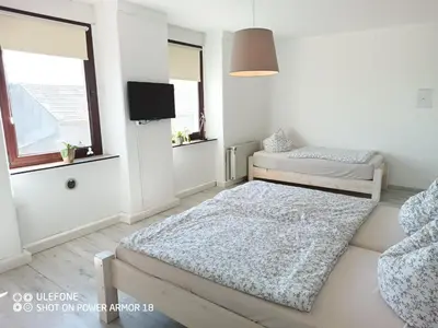 Ein Bett oder Betten in einem Zimmer der Unterkunft Ferienwohnung Großdobritz