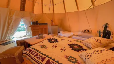 Ein Bett oder Betten in einem Zimmer der Unterkunft Tipi Alabama