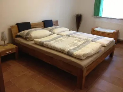 Ein Bett oder Betten in einem Zimmer der Unterkunft Fewo 4