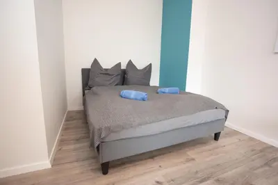 Ein Bett oder Betten in einem Zimmer der Unterkunft FullHouse - Chemnitz - R11 Apartments - Marketplace