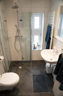 Ein Badezimmer in der Unterkunft Urlaubsfreude Biedermann Haus GlücksStein Ferienwohnung Saphir