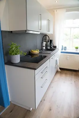 Küche/Küchenzeile in der Unterkunft Urlaubsfreude Biedermann Haus GlücksStein Ferienwohnung Saphir