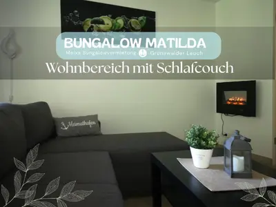 Ein Sitzbereich in der Unterkunft Bungalow Matilda