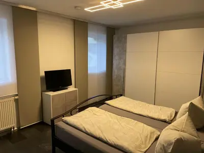 Ein Bett oder Betten in einem Zimmer der Unterkunft Ferienwohnung Pfarrlehn