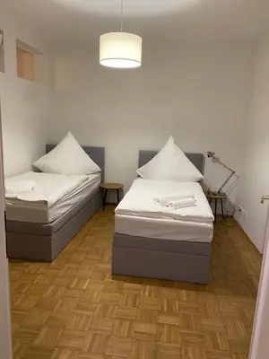 Ein Bett oder Betten in einem Zimmer der Unterkunft Ferienwohnung Villa Fortuna