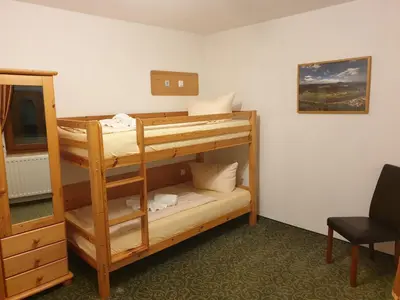 Ein Bett oder Betten in einem Zimmer der Unterkunft guesthouse Elbsandstein Appartement Lilienstein
