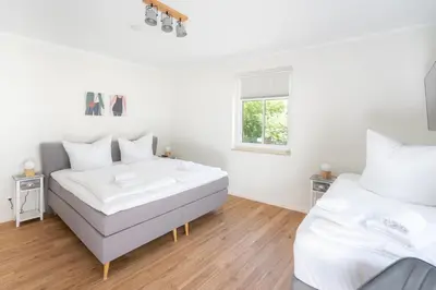 Ein Bett oder Betten in einem Zimmer der Unterkunft Burghof Apartments Hoyerswerda