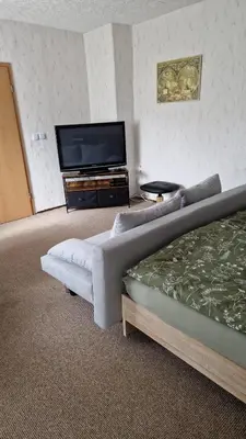 Ein Bett oder Betten in einem Zimmer der Unterkunft Ferienwohnung Glück Auf