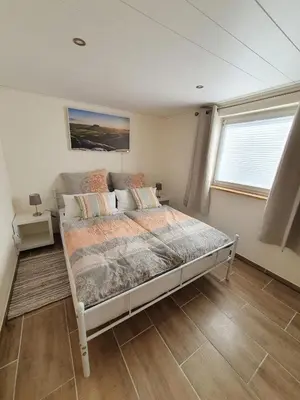 Ein Bett oder Betten in einem Zimmer der Unterkunft Ferienhaus Helmig
