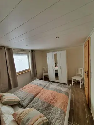 Ein Bett oder Betten in einem Zimmer der Unterkunft Ferienhaus Helmig