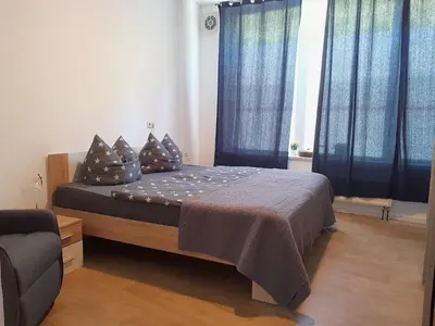 Ein Bett oder Betten in einem Zimmer der Unterkunft City Apartment #1 bei der Porzellan Manufaktur