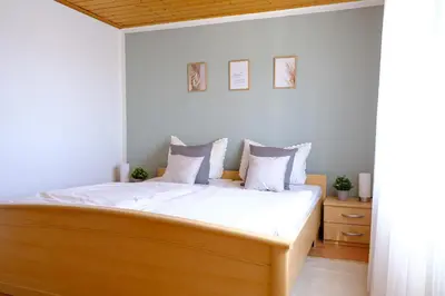Ein Bett oder Betten in einem Zimmer der Unterkunft Ferienhaus am Hainberg