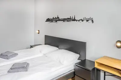 Ein Bett oder Betten in einem Zimmer der Unterkunft Hostel Am Windberg
