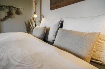 Ein Bett oder Betten in einem Zimmer der Unterkunft Urlaubsfreude Biedermann Haus GlücksStein Sandstein