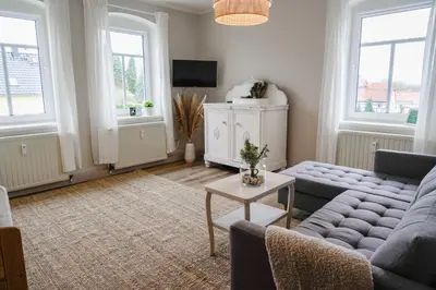 Ein Sitzbereich in der Unterkunft Urlaubsfreude Biedermann Haus GlücksStein Sandstein