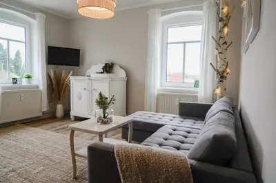 Ein Sitzbereich in der Unterkunft Urlaubsfreude Biedermann Haus GlücksStein Sandstein