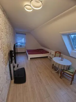 Ein Bett oder Betten in einem Zimmer der Unterkunft Ferienhaus Am Pilgerweg