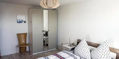 Ein Bett oder Betten in einem Zimmer der Unterkunft Ferienwohnung Burgstädt