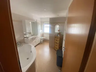 Ein Bett oder Betten in einem Zimmer der Unterkunft Ferienwohnung „Thea“