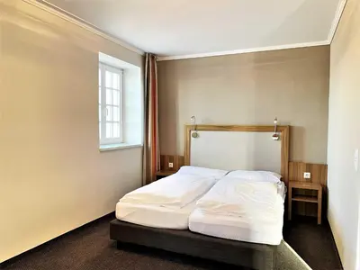 Ein Bett oder Betten in einem Zimmer der Unterkunft IBS Begegnungszentrum