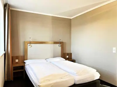 Ein Bett oder Betten in einem Zimmer der Unterkunft IBS Begegnungszentrum