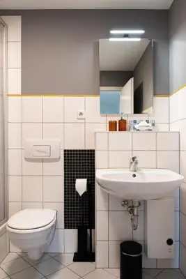 Ein Badezimmer in der Unterkunft Bauhaus Apartment - Netflix, Nespresso, Zentral, Messe