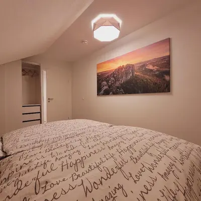 Ein Bett oder Betten in einem Zimmer der Unterkunft Ferienwohnung Festungsblick Königstein