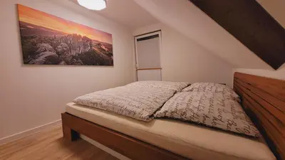 Ein Bett oder Betten in einem Zimmer der Unterkunft Ferienwohnung Festungsblick Königstein